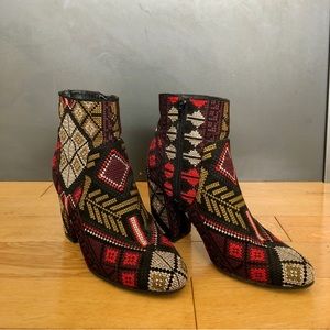 Black, red and green stitched boots from Rampage